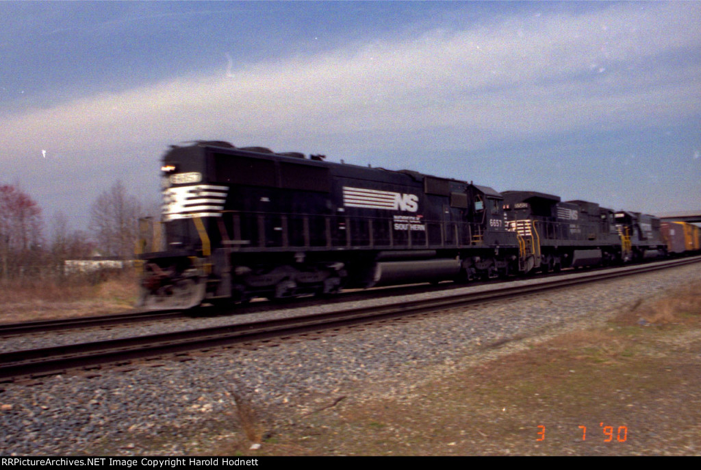 NS 6657 & 8582 lead a train southbound